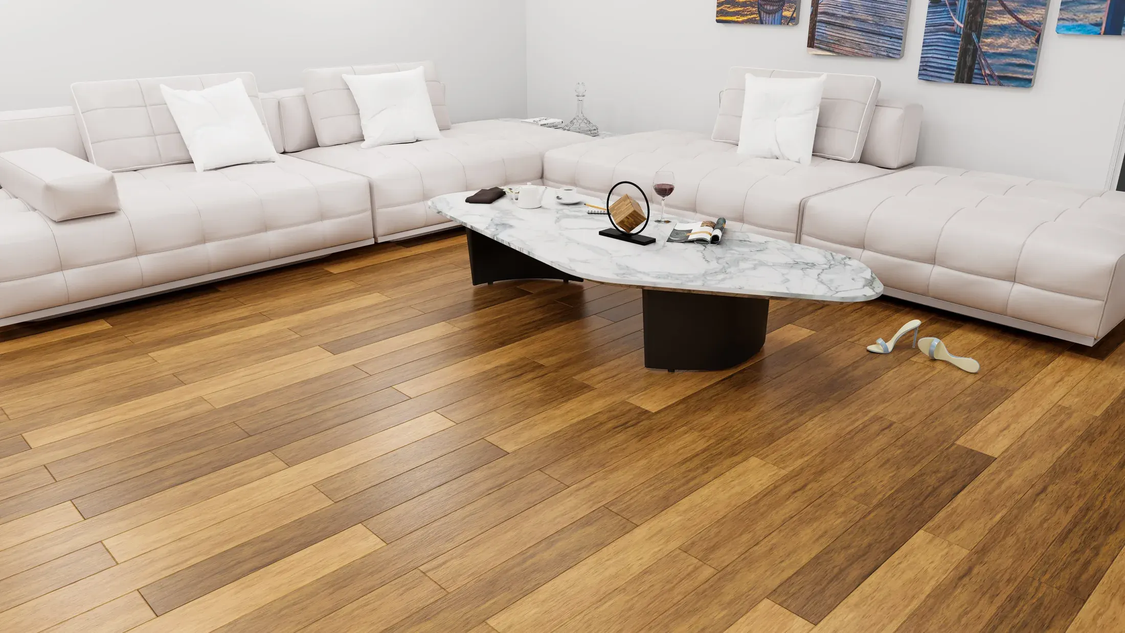 Bright living room with a white sectional sofa over newly installed warm-toned hardwood flooring